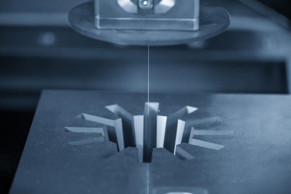 dreamstime_m_167403650 The Wire EDM machine cutting the gear shape of die insert. The mold and die manufacturing process by wire cut machine control by CNC program
