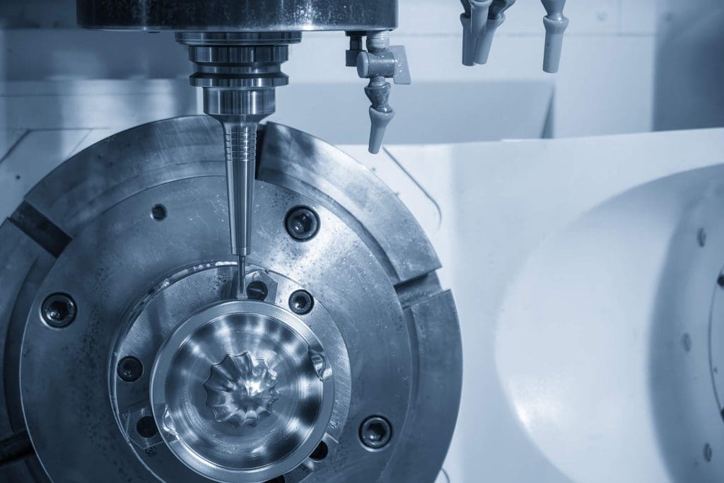 dreamstime_m_437165345 5-Axis CNC Milling Machine Cutting Mold Parts with Barrel Tool. This image illustrates a 5-axis CNC milling machine machining mold parts using a barrel cutting tool, representing advanced multi-axis manufacturing technology.