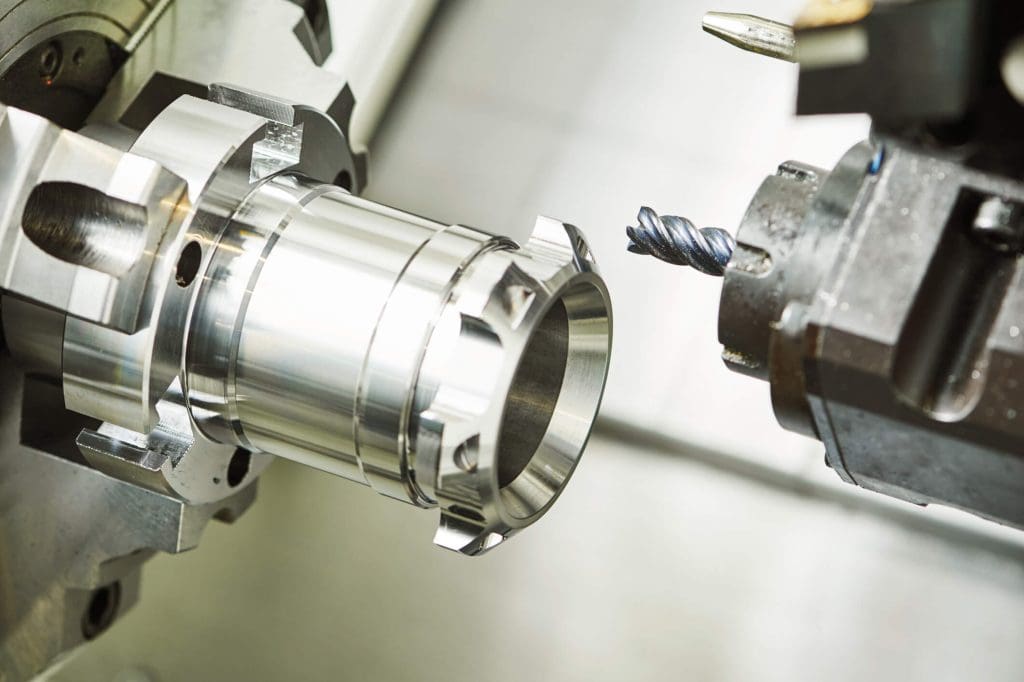 dreamstime_m_71145711 Industrial metalworking cutting process by milling cutter. Metalworking machining cutting process of blank detail by milling cutter with hardmetal carbide insert at modern cnc machine.